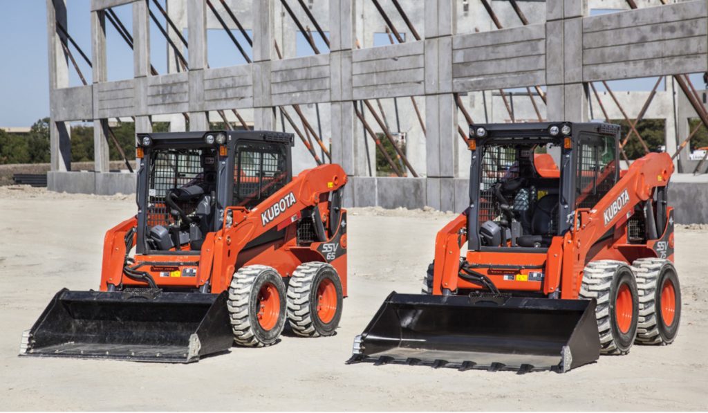 Photo of two skid steer excavators